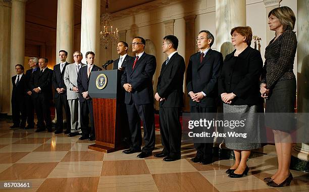 President Barack Obama makes an announcement as former National Economic Adviser Gene Sperling, Executive Director of the task force and Chief...