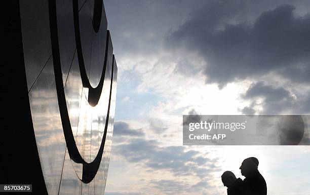 Israeli President Shimon Peres and Czech Republic's President Vaclav Klaus pay tribute in front of the monument at the former concentration camp of...