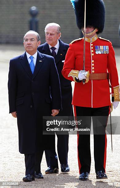 President Felipe Calderon of Mexico, accompanied by Prince Philip, Duke of Edinburgh, inspects a Guard of Honour during an official ceremonial...