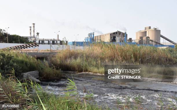 Picture shows on July 20, 2017 the state-owned Tunisian Chemical Group 's phosphate processing plant close to the Chott Essalem beach and in front of...