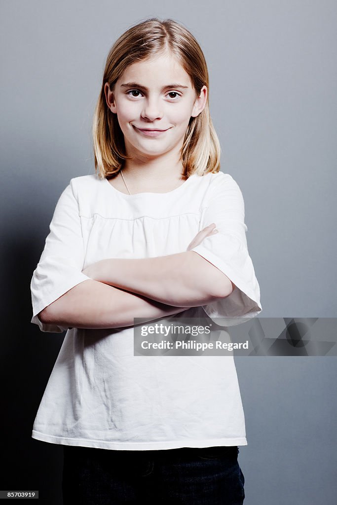 Cute 9 years old girl smiling at camera