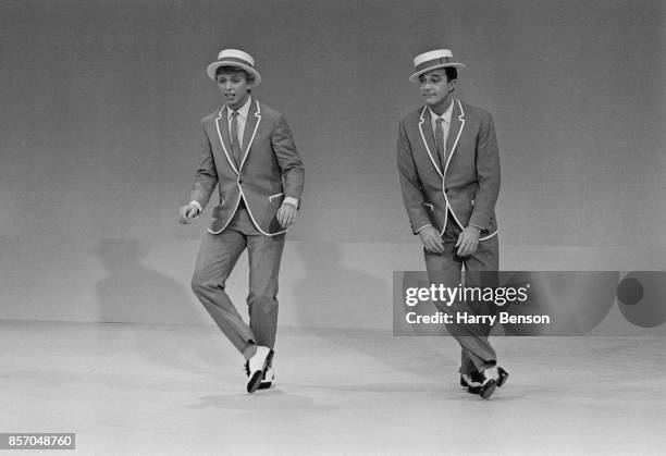 Entertainers Gene Kelly and Tommy Steele reharsing for a TV show, 2nd October 1965.