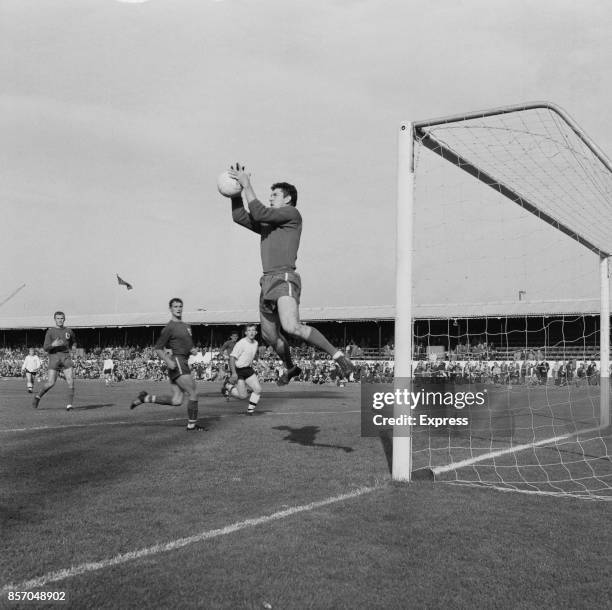 English football goalkeeper Ken Hancock of Ipswich Town FC makes a save against Bolton Wanderers FC, UK, 20th September 1965.