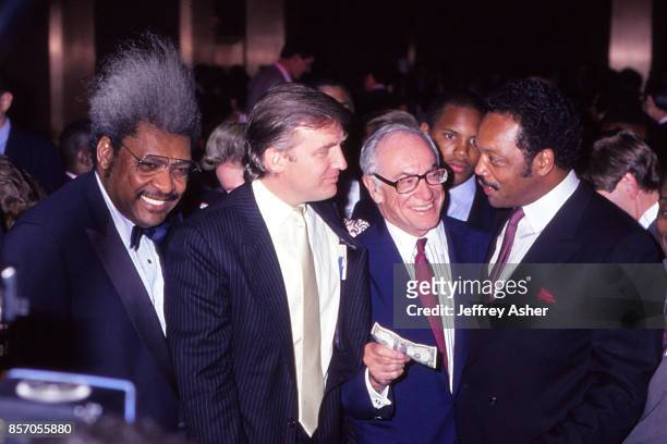 Boxing Promoter Don King Businessman Donald Trump Entrepreneur and Publisher Malcolm Forbes make a dollar wager with Reverend Jesse Jackson Sr. At...