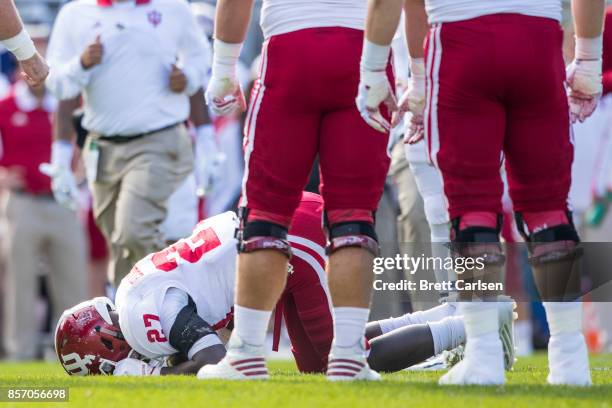 Morgan Ellison of the Indiana Hoosiers lies on the field after being shaken up on the previous play during the game against the Penn State Nittany...