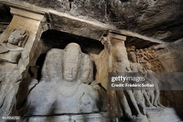 Elephanta Caves. Statue of Hindu deity Shiva, at the Elephanta Caves in Elephanta Island in Mumbai on March 12, 2012 in Mumbai, India.