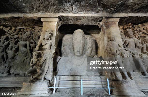 Elephanta Caves. Statue of Hindu deity Shiva, at the Elephanta Caves in Elephanta Island in Mumbai on March 12, 2012 in Mumbai, India.