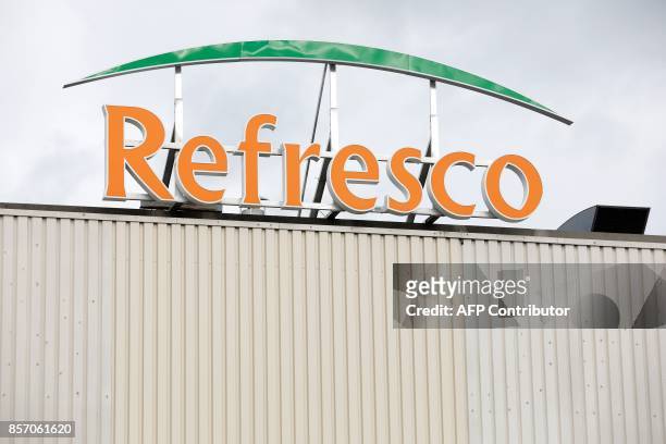 Picture taken in Boegraven, on October 3, 2017 shows a view of the Refresco logo on the roof of the factory. Refresco, Europe's largest juice and...