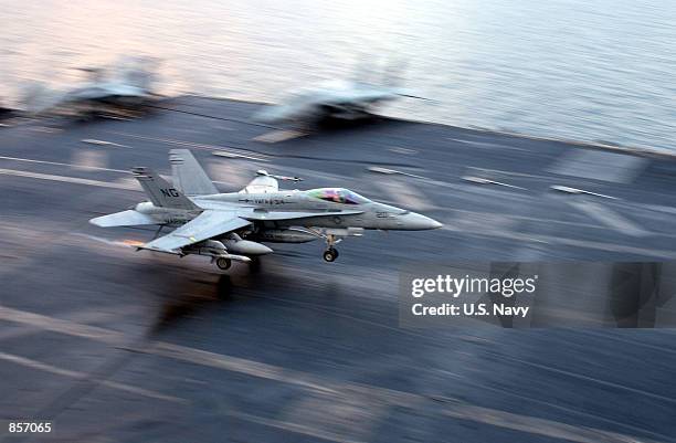 An F/A-18 "Hornet" from the "Black Knights" of Marine Fighter Attack Squadron Three One Four makes an arrested landing on the flight deck February...
