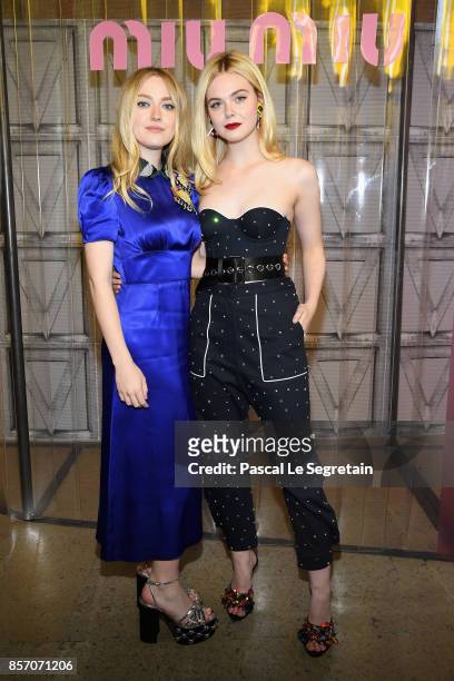 Dakota Fanning and Elle Fanning attend the Miu Miu show as part of the Paris Fashion Week Womenswear Spring/Summer 2018 on October 3, 2017 in Paris,...