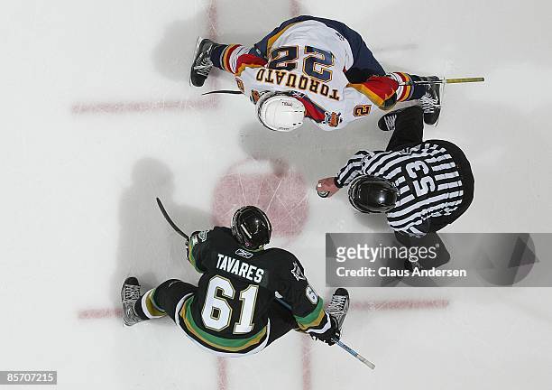 John Tavares of the London Knights gets set to take a faceoff against Zack Torquato of the Erie Otters in Game 5 of the opening round of the 2009...