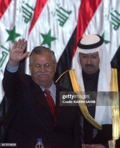 Former Iraqi interim president and now newly elected Vice President Ghazi al-Yawar looks on as Iraq's President Jalal Talabani waves to the National...