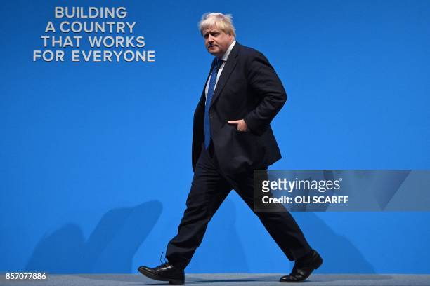 Britain's Foreign Secretary Boris Johnson arrives to deliver his speech on the third day of the Conservative Party annual conference at the...