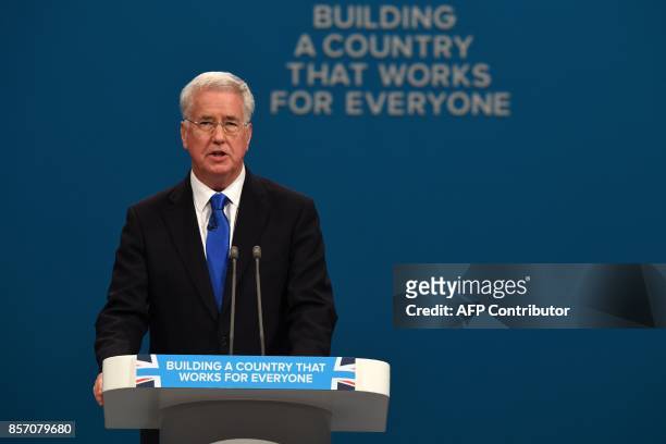 Britain's Defence Secretary Michael Fallon delivers his speech on the third day of the Conservative Party annual conference at the Manchester Central...
