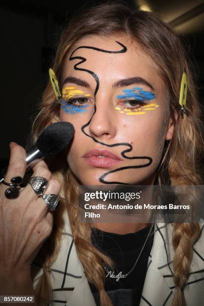 Model prepares Backstage Prior the L'oreal Show as part of the Paris Fashion Week Womenswear Spring/Summer 2018 on October 1, 2017 in Paris, France.