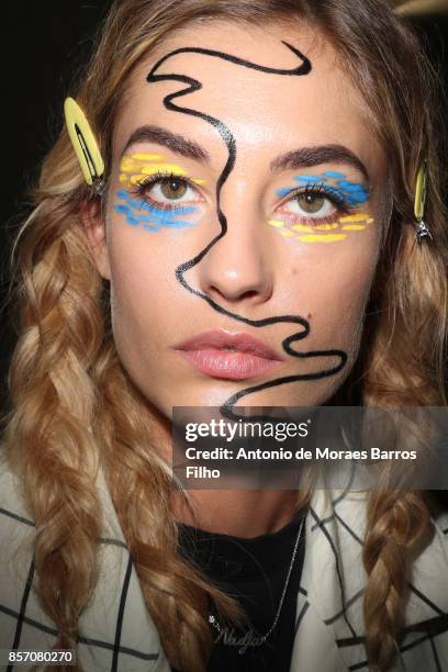 Model prepares Backstage Prior the L'oreal Show as part of the Paris Fashion Week Womenswear Spring/Summer 2018 on October 1, 2017 in Paris, France.