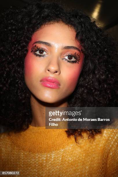 Model prepares Backstage Prior the L'oreal Show as part of the Paris Fashion Week Womenswear Spring/Summer 2018 on October 1, 2017 in Paris, France.
