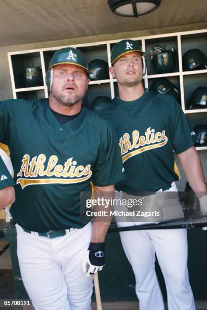 Jason Giambi and Matt Holliday of the Oakland Athletics in the dugout prior to the game against the Milwaukee Brewers at the Phoenix Municpal Stadium...