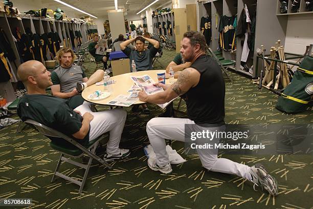 Matt Holliday, Travis Buck, Kurt Suzuki and Jason Giambi of the Oakland Athletics in the clubhouse prior to the game against the Milwaukee Brewers at...