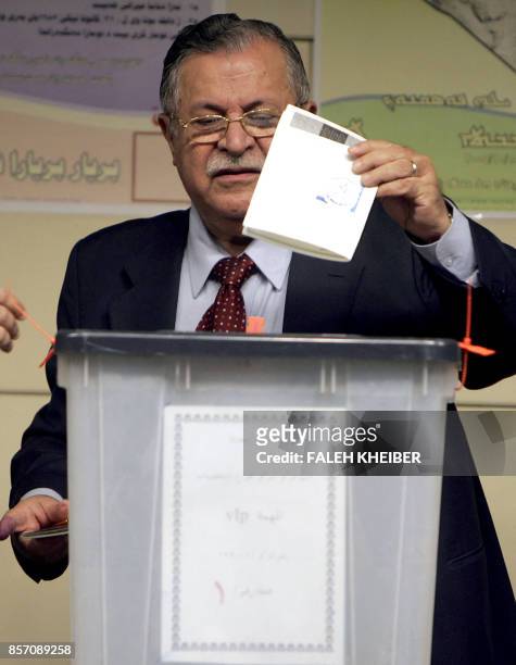 Iraqi President Jalal Talabani votes in the constitutional referendum in Baghdad 15 October 2005. Iraqis voted amid tight security Saturday in a...