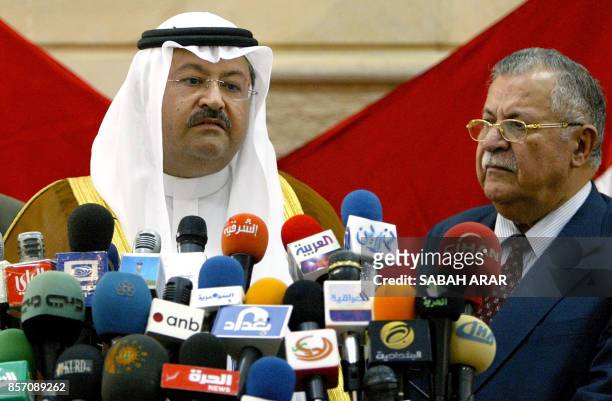 Iraqi Vice President Ghazi al-Yawer, speaks to press as Iraqi President Jalal Talabani listens as he announces a last-ditch political deal aimed at...