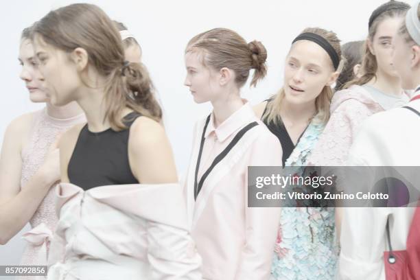 Models pose prior the Moncler Gamme Rouge show as part of the Paris Fashion Week Womenswear Spring/Summer 2018 on October 3, 2017 in Paris, France.