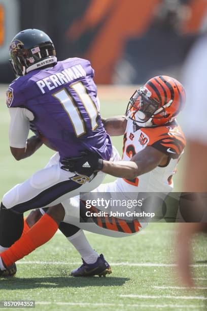 William Jackson of the Cincinnati Bengals makes the tackle on Breshad Perriman of the Baltimore Ravens during their game at Paul Brown Stadium on...