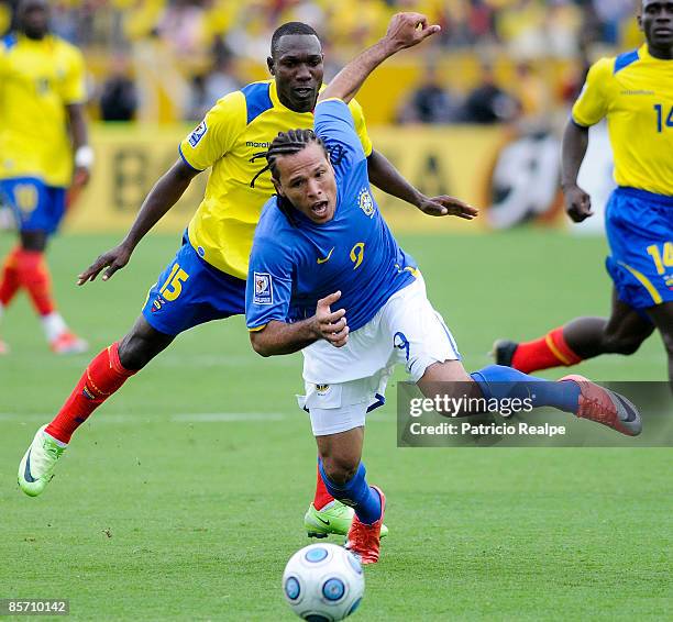 Segundo Castillo fights for the ball against Brazil's player Luis Fabiano during their FIFA 2010 World Cup Qualifying match at the Atahualpa Olympic...