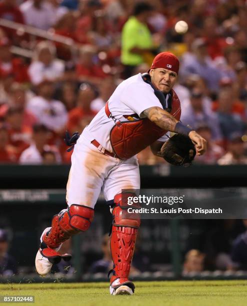 St. Louis Cardinals catcher Yadier Molina throws out the San Diego Padres' Carlos Asuaje on a sacrifice bunt in the fifth inning on Tuesday, Aug. 22...