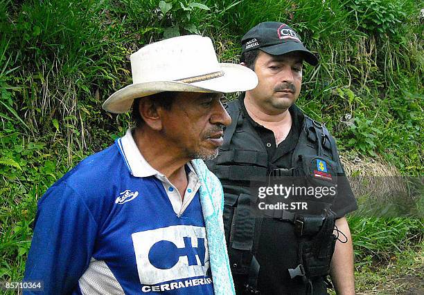 Picture of Arcebio Alvarez , aka "the Monster of Mariquita", while he is taken under custody by Colombian investigators on March 25 in Mariquita,...