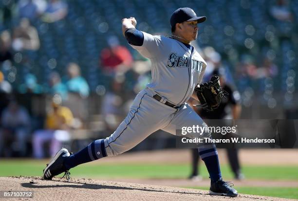 Erasmo Ramirez of the Seattle Mariners pitches against the Oakland Athletics in the bottom of the first inning at Oakland Alameda Coliseum on...