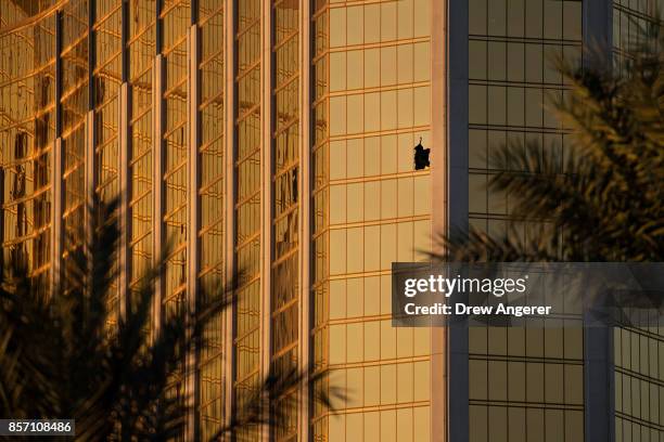 Window is broken on the 32nd floor of the Mandalay Bay Resort and Casino where a gunman opened fire on a concert crowd on Sunday night, October 3,...