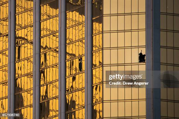 Window is broken on the 32nd floor of the Mandalay Bay Resort and Casino where a gunman opened fire on a concert crowd on Sunday night, October 3,...