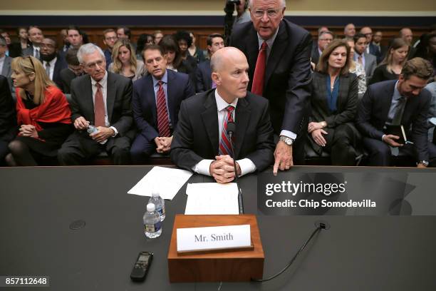 Former Republican Senator from Georgia Saxby Chambliss advises former Equifax CEO Richard Smith before he testifies to the House Energy and Commerce...