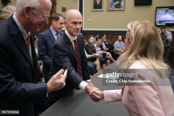 Former Senator Saxby Chambliss introduces former Equifax CEO Richard Smith to Rep. Debbie Dingell before Smith testifies to the House Energy and...