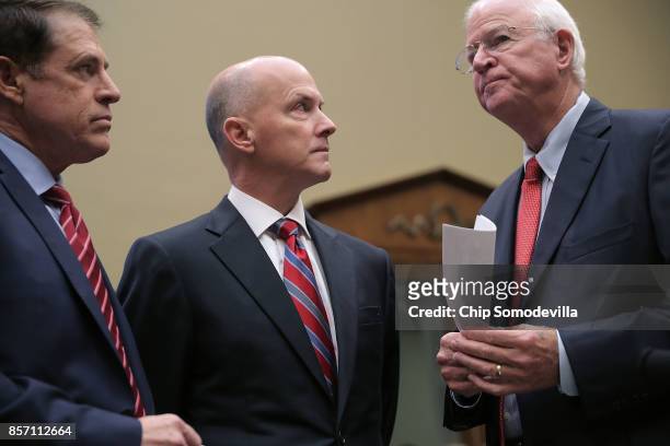 Pasadena City Councilmember Steve Madison, former Equifax CEO Richard Smith and Former Republican Senator from Georgia Saxby Chambliss talk before...