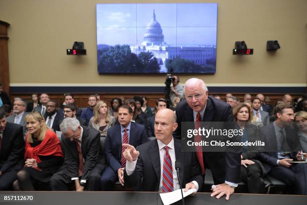 Former Republican Senator from Georgia Saxby Chambliss advises former Equifax CEO Richard Smith before he testifies to the House Energy and Commerce...