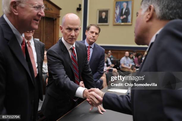 Former Senator Saxby Chambliss, former Equifax CEO Richard Smith, Pasadena City Councilmember Steve Madison and Rep. Antonio Cardenas greet one...