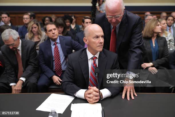 Former Republican Senator from Georgia Saxby Chambliss advises former Equifax CEO Richard Smith before he testifies to the House Energy and Commerce...