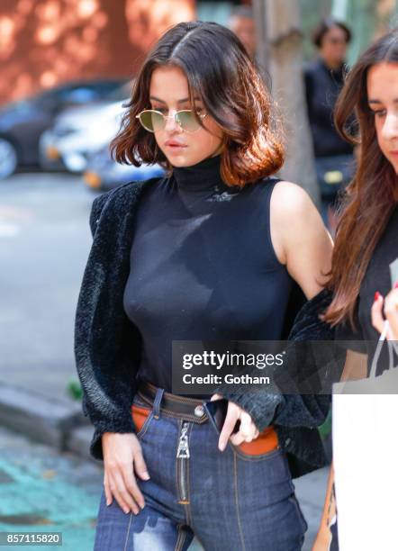 Selena Gomez goes braless on October 3, 2017 in New York City.