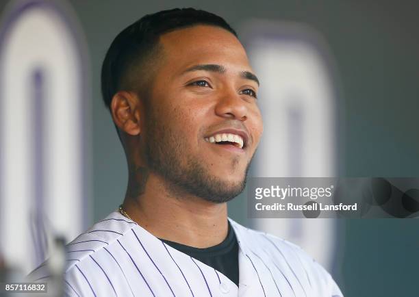 Alexi Amarista of the Colorado Rockies sits in the dugout during a regular season MLB game between the Colorado Rockies and the visiting Los Angeles...