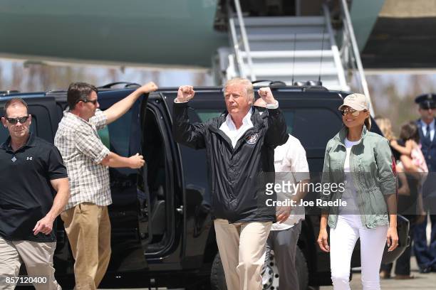 President Donald Trump and Melania Trump arrive on Air Force One at the Muniz Air National Guard Base for a visit after Hurricane Maria hit the...