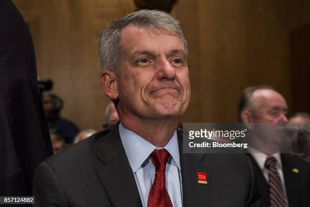 Tim Sloan, chief executive officer and president of Wells Fargo & Co., arrives to testify before a Senate Banking, Housing and Urban Affairs...
