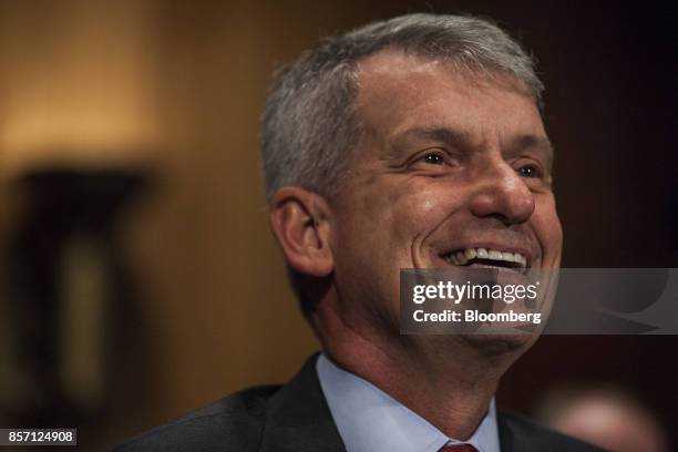 Tim Sloan, chief executive officer and president of Wells Fargo & Co., smiles during a Senate Banking, Housing and Urban Affairs Committee hearing in...