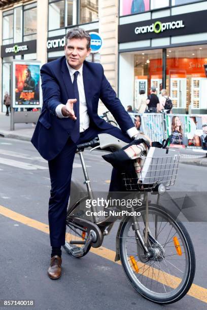 French former Minister of Industrial Arnaud Montebourg cycling in Paris, France, on September 27, 2017.