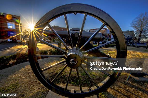 sun star on old civil war cannon in town square - franklin stock pictures, royalty-free photos & images