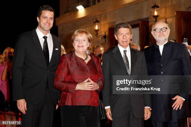 Intendants of the State Opera Juergen Flimm and Matthias Schulz pose with German Chancellor Angela Merkel and her husband Joachim Sauer attend the...