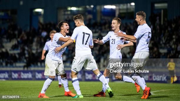 Scorer Timon Burmeister celebrates his teams first goal with Marvin Obuz , Albin Thaqi and Sebastian Papalia of Germany during the friendly match...