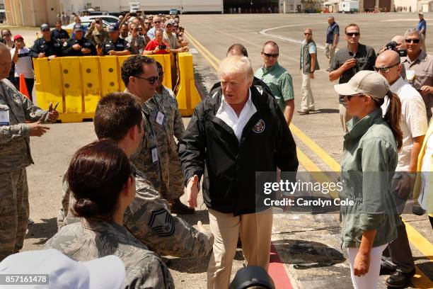 President Donald Trump and the First Lady Melania Trump arrive Muniz Air National Guard Base in Carolina, Puerto Rico on Oct. 3 almost two weeks...