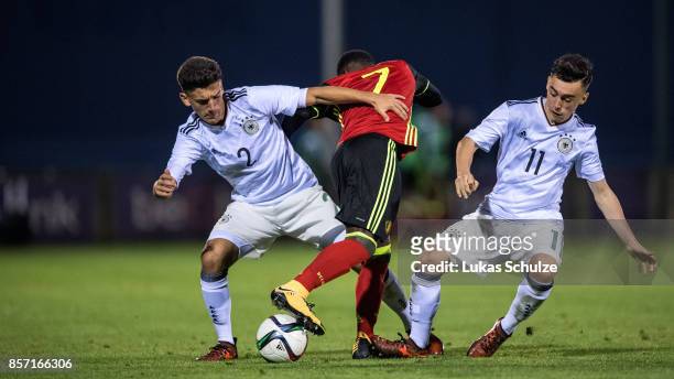 Atmir Krasniqi , Pauk Nebel of Germany and Jeremy Doku of Belgium fight for the ball during the friendly match between Belgium U16 and Germany U16 on...